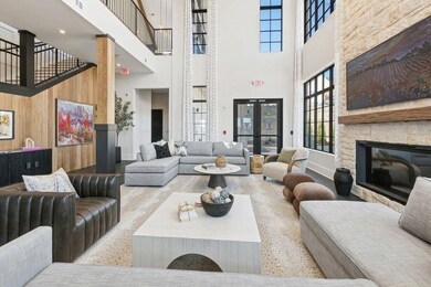 Living room featuring french doors, a towering cei