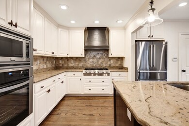Kitchen with premium range hood, stainless steel a