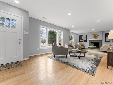 Living room featuring light wood-type flooring, a