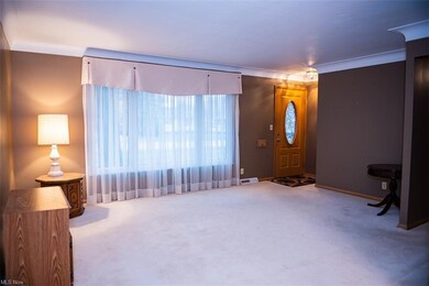 You walk into the very spacious living room, updat