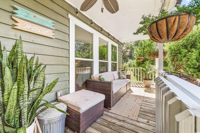 Deck with an outdoor hangout area and ceiling fan