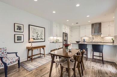 Dining space featuring recessed lighting and wood