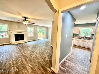 FOYER INTO LIVING AND KITCHEN