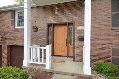 The covered front entry protects guests from the e