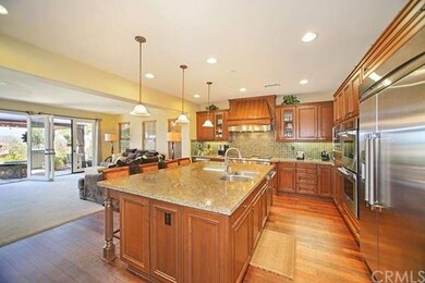 The light and bright kitchen opens to the family r