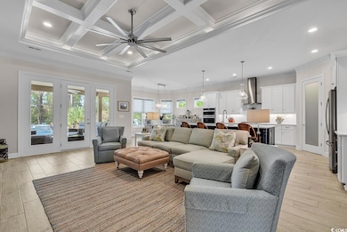Living room featuring ornamental molding, a ceilin