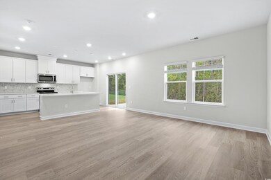 Kitchen featuring stainless steel appliances, tast
