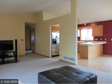 Vaulted ceilings and large windows make this space