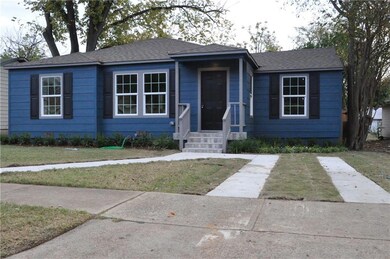 View of front of house with new landscape and driv