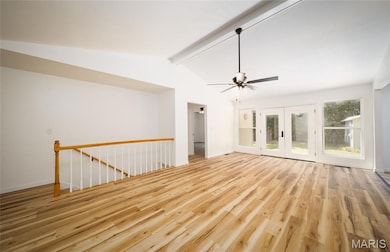 Empty room featuring light wood-type flooring and ceiling fan