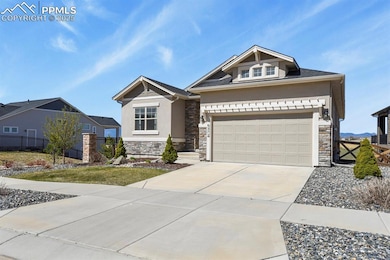 Craftsman house with stucco siding, stone siding, concrete driveway, and an attached garage