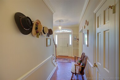 Dentil molding and brick pavers in entry.