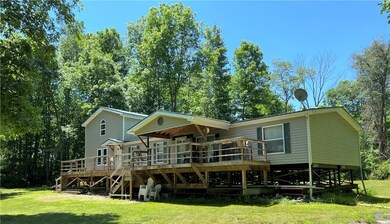 Elevated manufactured home on helical piers