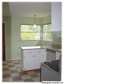 A view of the kitchen from the dining room