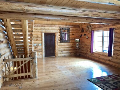 View from dining area toward front door and stairc