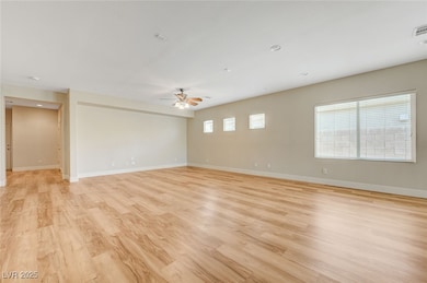 Spare room featuring ceiling fan, light wood-type
