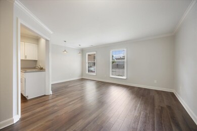Dinning room featuring ornamental molding, and dar