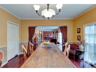 Dining room with family room in the distance and d
