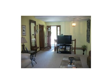 Foyer opens to living room.