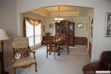 Formal living leading into formal dining room. All