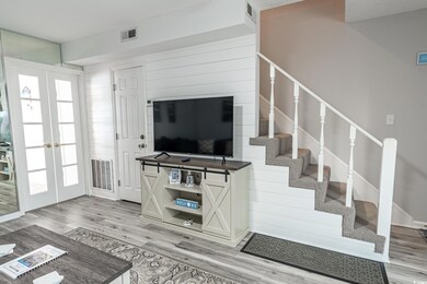Living room featuring french doors and hardwood / 
