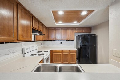 Kitchen with freestanding refrigerator, white ran