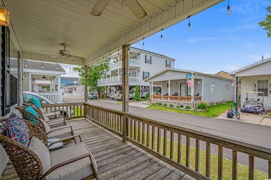 Wooden deck featuring ceiling fan
