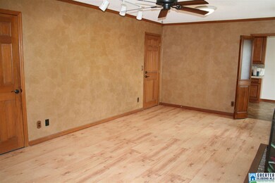 FAMILY ROOM. DOOR TO THE LEFT GOES DOWN TO BASEMEN