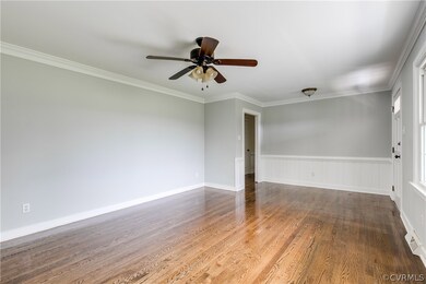 Crown molding and a ceiling fan are added features