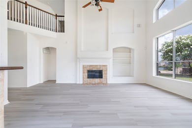 This is a spacious living room with high ceilings,