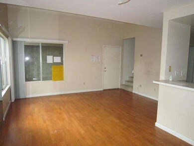 Living room and front door from dining area -