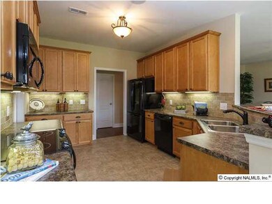 Kichen has smart flow with access door leading directly to the garage for quick grocery storage. Don't miss this homes's 