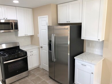 Kitchen with Quartz Countertops and Stainless Appliances
