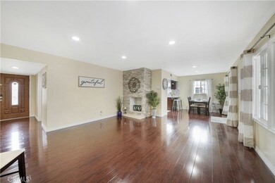 Beautifully Upgraded Throughout with Plank-Style Wood Laminate Flooring, Recessed Lighting, Smooth Ceilings, All Dual Pane Windows & Sliders, Custom Heavy-Duty Screen Doors, Stacked Stone Fireplace, and More!