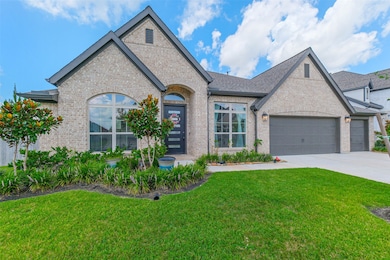 Beautiful landscaping frames the front of the home