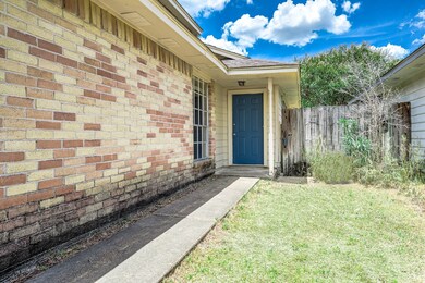 Approaching the front door you will see the beautiful brick elevation, covered front porch, and blue front door!