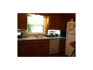 Super cute kitchen has glass blocks for extra ligh
