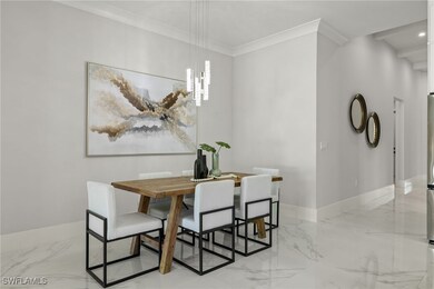 Dining area with ornamental molding
