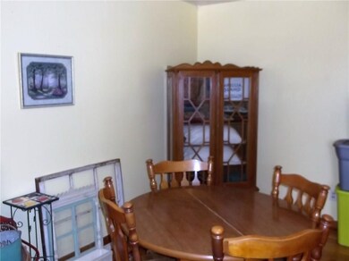 Spacious dining room with lovely hardwood floors.