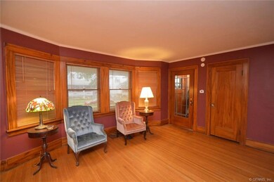 MAIN FLOOR FORMAL LIVING ROOM WITH COAT CLOSET