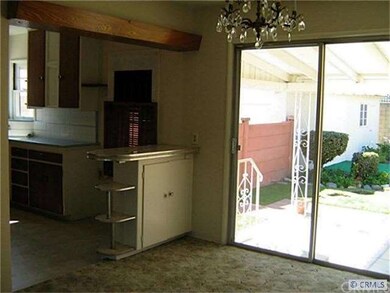 Dining area looks into kitchen