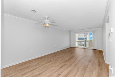 Unfurnished living room with visible vents, light 