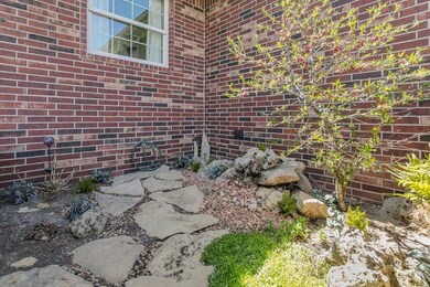 Garden with fountain and front entrance