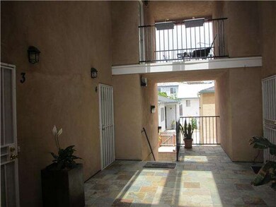Stairs up to front door. Balcony above