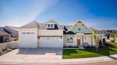 View of front of home featuring stone siding, a garage, concrete driveway, and roof with shingles