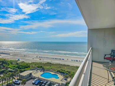 Balcony featuring a water view, a beach view, and 