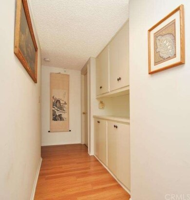 Another view of hallway with wood flooring, lookin