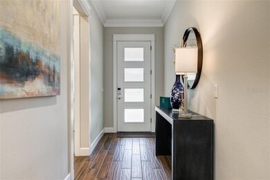 FOYER WITH WOOD PLANK TILE FLOORING