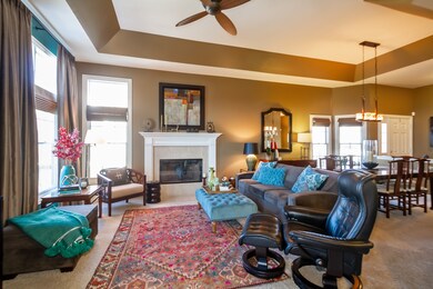 high tray ceiling and fireplace