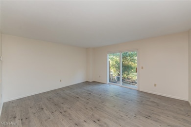 Empty room with light wood finished floors and​​‌​​​​‌​​‌‌​​​‌​​‌‌​​‌‌​‌​​​‌‌​​‌​​​​​‌ baseboards